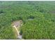 High aerial view showing a property amongst mature trees at 5588 Rhododendron Trl, Douglasville, GA 30135