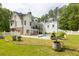 A beautiful backyard features a pool, patio, and lush green lawn at 5588 Rhododendron Trl, Douglasville, GA 30135