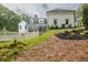 A luxurious backyard featuring a pool and patio surrounded by lush greenery at 5588 Rhododendron Trl, Douglasville, GA 30135