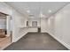 A finished basement area with a suspended tile ceiling, recessed lighting, and open doorway to an additional Gathering area at 5588 Rhododendron Trl, Douglasville, GA 30135