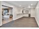 A finished basement area with a suspended tile ceiling, recessed lighting, and open doorway to an additional Gathering area at 5588 Rhododendron Trl, Douglasville, GA 30135