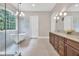 Bright bathroom with dual vanity, large mirror, and soaking tub at 5588 Rhododendron Trl, Douglasville, GA 30135