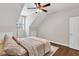 A bedroom with wood floors, neutral walls, recessed lights, ceiling fan, and a window allows natural light at 5588 Rhododendron Trl, Douglasville, GA 30135