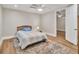 Bright bedroom with ceiling fan, neutral tones, and hardwood floors at 5588 Rhododendron Trl, Douglasville, GA 30135