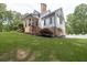 Beautiful home exterior showcasing a well-maintained yard and architectural details at 5588 Rhododendron Trl, Douglasville, GA 30135