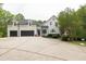 A beautiful home exterior with a spacious driveway and three car garage at 5588 Rhododendron Trl, Douglasville, GA 30135