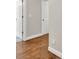 Hallway with wood floors and white molding at 5588 Rhododendron Trl, Douglasville, GA 30135