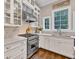 Gourmet kitchen featuring stainless appliances and custom cabinetry at 5588 Rhododendron Trl, Douglasville, GA 30135