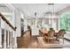 Open-concept kitchen with stainless appliances, modern lighting, and dining area at 5588 Rhododendron Trl, Douglasville, GA 30135