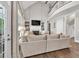 Bright living room featuring a fireplace, built-in shelving, and a view into the breakfast area at 5588 Rhododendron Trl, Douglasville, GA 30135