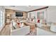 Inviting living room with wood accent wall, comfortable seating, and hardwood floors at 5588 Rhododendron Trl, Douglasville, GA 30135