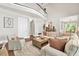 Comfortable living room with vaulted ceiling, cozy seating, and a view into the kitchen at 5588 Rhododendron Trl, Douglasville, GA 30135
