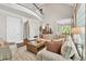 Inviting living room with comfortable seating, a cozy rug, and a view into the kitchen at 5588 Rhododendron Trl, Douglasville, GA 30135