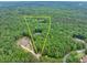 Aerial view of lot with property line amid the green forest at 5588 Rhododendron Trl, Douglasville, GA 30135