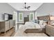 Spacious main bedroom features neutral walls, a ceiling fan, and lots of natural light at 5588 Rhododendron Trl, Douglasville, GA 30135
