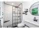 Modern bathroom with white subway tile shower, a sleek glass door, and a vanity sink at 2884 Bent Creek Nw Dr, Kennesaw, GA 30152