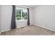 Carpeted bedroom with a sunny window view featuring neutral paint color at 2884 Bent Creek Nw Dr, Kennesaw, GA 30152