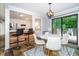 Charming dining area with modern lighting, stylish chairs, and easy access to the kitchen and outdoor deck at 2884 Bent Creek Nw Dr, Kennesaw, GA 30152