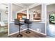 Eat-in dining room area with pass-through bar and view of the living room, featuring modern lighting at 2884 Bent Creek Nw Dr, Kennesaw, GA 30152