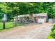 Lovely brick home with a well-maintained lawn, fenced yard, and a detached garage at 2884 Bent Creek Nw Dr, Kennesaw, GA 30152