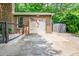 Attached garage with a flag hanging, showcasing the brick exterior and tidy landscaping at 2884 Bent Creek Nw Dr, Kennesaw, GA 30152