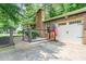 Brick home with an attached garage, American flag, and fenced yard, creating a welcoming curb appeal at 2884 Bent Creek Nw Dr, Kennesaw, GA 30152