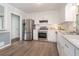 Bright kitchen with stainless steel appliances, ample cabinet space, and modern finishes for an efficient cooking area at 2884 Bent Creek Nw Dr, Kennesaw, GA 30152