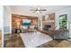 Inviting living room with a brick fireplace, wood accent wall, and neutral decor for a cozy and stylish ambiance at 2884 Bent Creek Nw Dr, Kennesaw, GA 30152