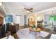 Open-concept living area with a cozy fireplace, sliding barn door, and seamless flow to the kitchen and dining spaces at 2884 Bent Creek Nw Dr, Kennesaw, GA 30152
