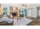Spacious living room with a brick fireplace, large windows, and a sliding barn door for flexible living space at 2884 Bent Creek Nw Dr, Kennesaw, GA 30152
