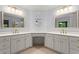 Bright bathroom features double vanities, vanity space, and gold fixtures at 2910 Leeds Garden Ln, Alpharetta, GA 30022