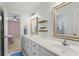 Bright bathroom features double sinks with stylish fixtures at 2910 Leeds Garden Ln, Alpharetta, GA 30022