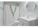 White bathroom with shower/tub combination and stylish fixtures at 2910 Leeds Garden Ln, Alpharetta, GA 30022