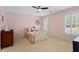 Bedroom features a sunny window, and neutral carpeting at 2910 Leeds Garden Ln, Alpharetta, GA 30022