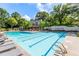 A large pool with lounge chairs, a building, and the 'Chartwell' sign in the background at 2910 Leeds Garden Ln, Alpharetta, GA 30022