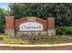 Stone and brick welcome sign for Chartwell with colorful flowers at 2910 Leeds Garden Ln, Alpharetta, GA 30022