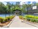 Covered seating area between tennis courts at 2910 Leeds Garden Ln, Alpharetta, GA 30022