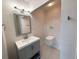 Bright bathroom featuring a modern vanity with grey cabinets and stainless steel fixtures at 30 5Th Ne St # 1006, Atlanta, GA 30308