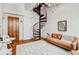 Inviting living room with spiral staircase, hardwood floors, and a cozy seating area at 30 5Th Ne St # 1006, Atlanta, GA 30308