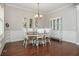 Dining room featuring hardwood floors, traditional furniture, and natural light at 4840 Chase Ln, Cumming, GA 30040