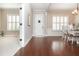 Elegant entryway with hardwood floors leading to various living spaces and natural light at 4840 Chase Ln, Cumming, GA 30040