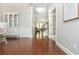 Elegant entryway showcasing hardwood floors and views into the staircase and living spaces at 4840 Chase Ln, Cumming, GA 30040