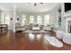 Spacious living room with hardwood floors, bay window, fireplace, and comfortable seating at 4840 Chase Ln, Cumming, GA 30040