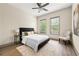 Bright bedroom with a ceiling fan, neutral walls, and windows with natural light at , Atlanta, GA 30313