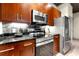 Close up of a kitchen with wooden cabinets and stainless steel appliances at , Atlanta, GA 30313