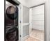Laundry area featuring a modern washer/dryer unit and a view into a spacious closet at , Atlanta, GA 30313