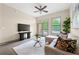 Inviting living area with comfortable seating, ceiling fan and a view of outdoor greenery at , Atlanta, GA 30313