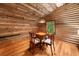 Attic game room featuring wood walls, sloped ceiling, wood floors and a game table at 15 Bailey St, Whitesburg, GA 30185