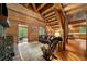 Inviting living area with a stone fireplace, wood accents, and comfortable seating at 15 Bailey St, Whitesburg, GA 30185