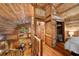 Lofted space with wood accents, connecting dining area, bedroom, and bathroom at 15 Bailey St, Whitesburg, GA 30185